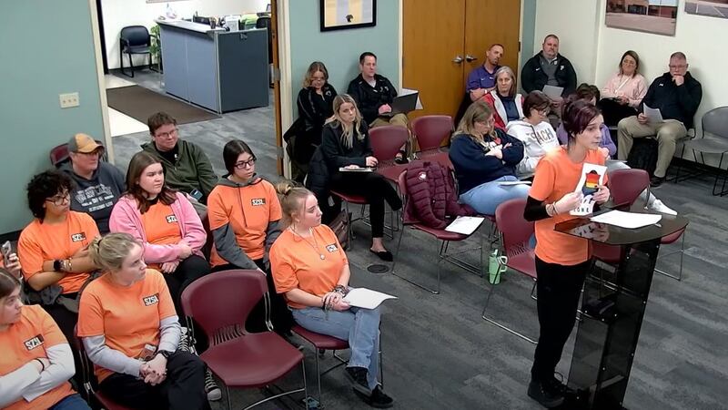 PAOLA, Kan. -- A group of students advocate for the return of rainbow safe zone signs at Paola...