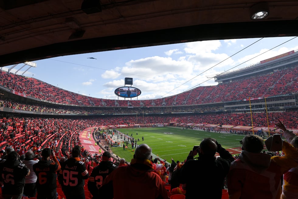 Fans cheer in Arrowhead Stadium during a flyover before an NFL divisional round football game...