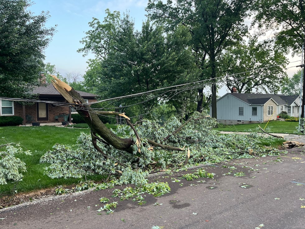 Tree branches litter streets in Independence, Mo.