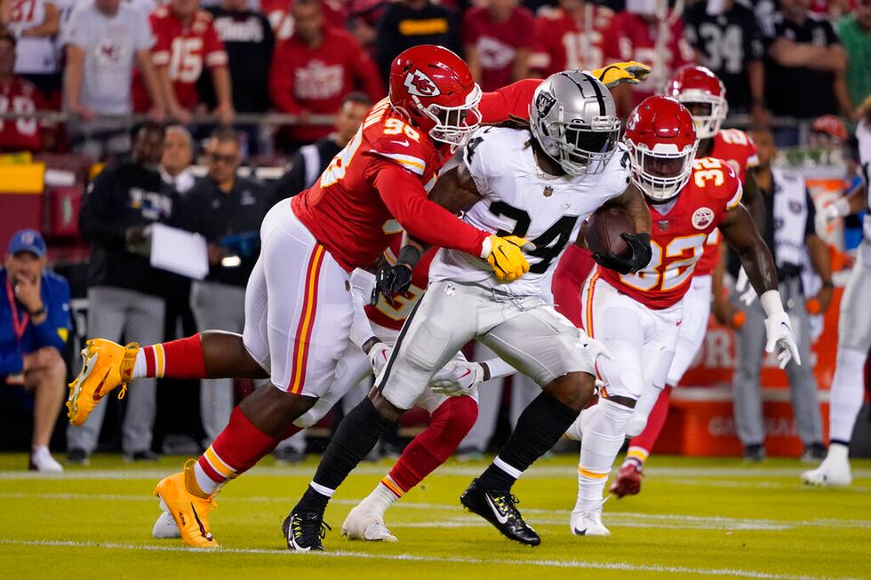 Las Vegas Raiders running back Brandon Bolden (34) runs with the ball as Kansas City Chiefs...
