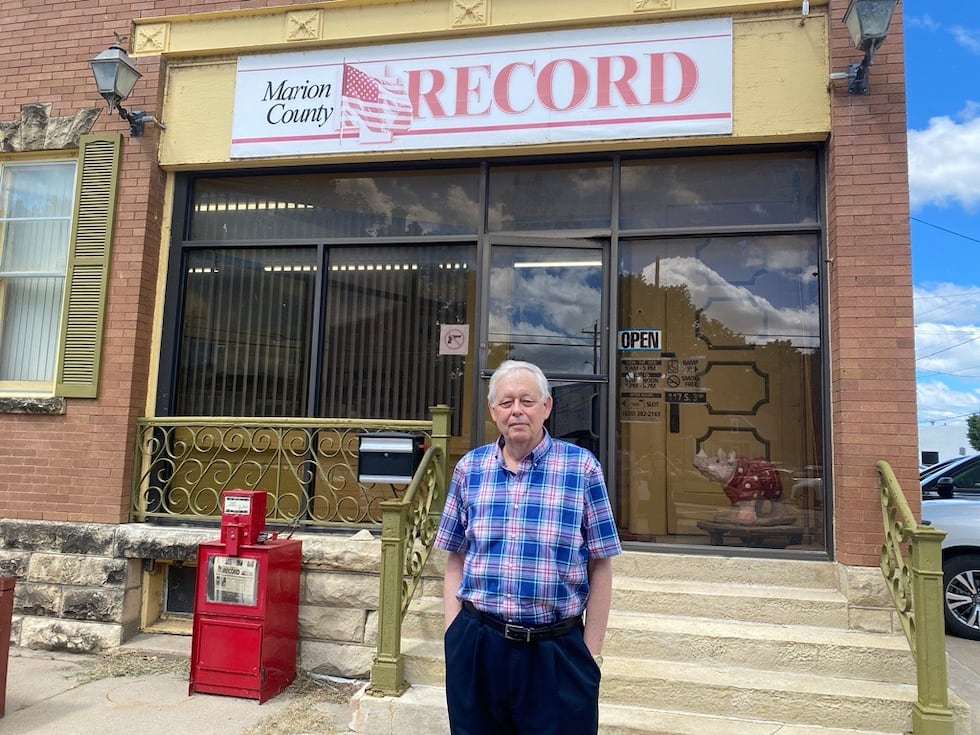 Eric Meyer, the editor and publisher of the Marion County Record, stands in front of his...