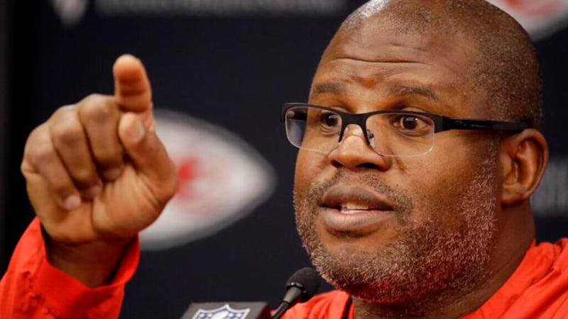 FILE - Kansas City Chiefs offensive coordinator Eric Bieniemy addresses the media during an...