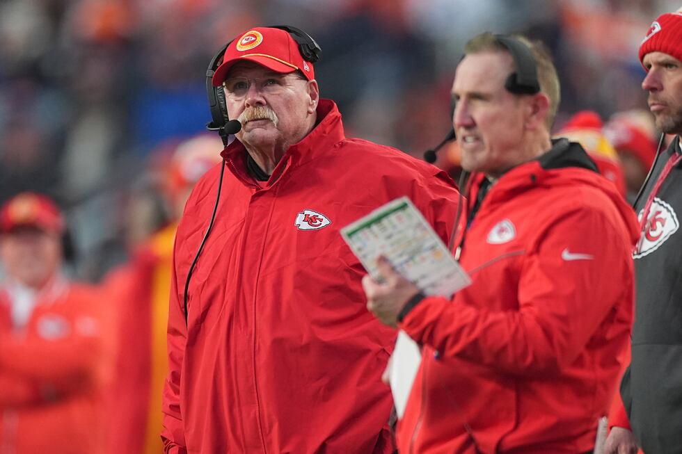 Kansas City Chiefs head coach Andy Reid watches from the sidelines alongside defensive...