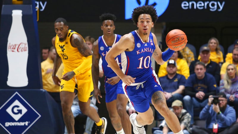 Kansas forward Jalen Wilson (10) runs up court against West Virginia during the first half of...