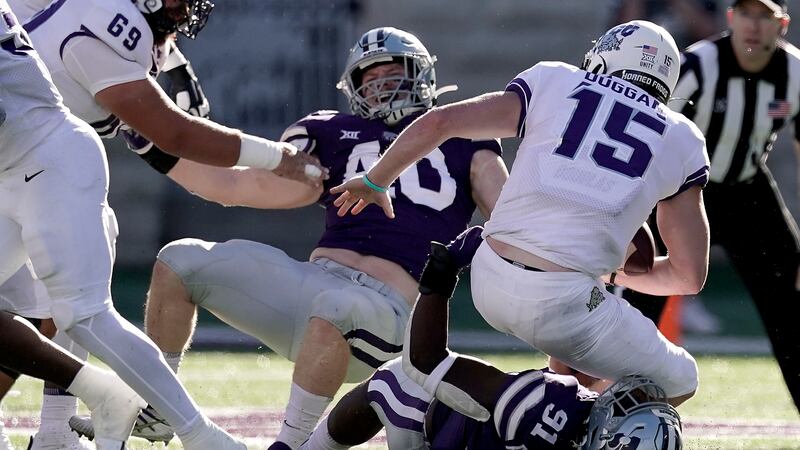 FILE: TCU quarterback Max Duggan (15) is sacked by Kansas State defensive end Felix...