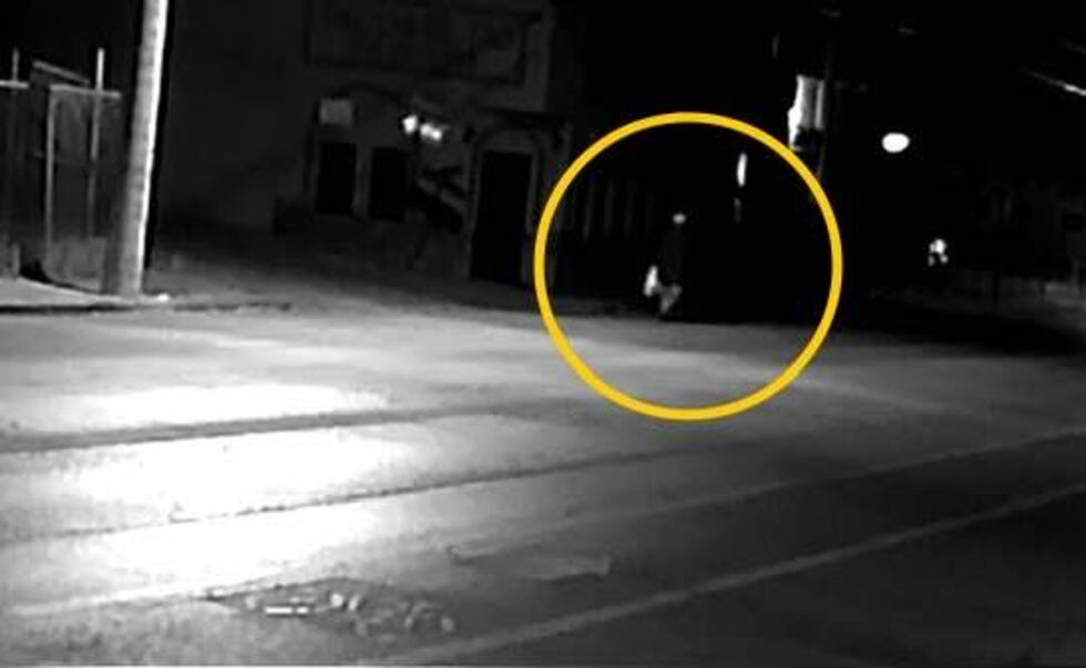 The man can then be seen further up the street past Reynolds.