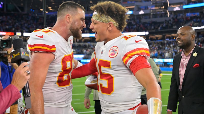 Kansas City Chiefs tight end Travis Kelce, left, and quarterback Patrick Mahomes celebrate...