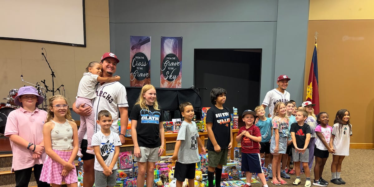 Kansas City Monarchs players deliver toys to Johnson County kids at Salvation Army Christmas in July event