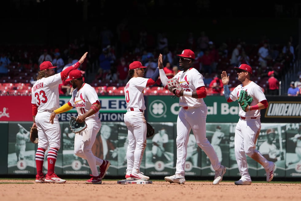 of the St. Louis Cardinals celebrate a victory over the Pittsburgh Pirates in a...