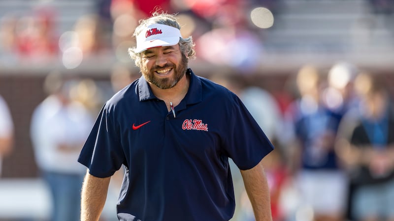 Mississippi defensive coordinator Pete Golding grins on the field before an NCAA football game...