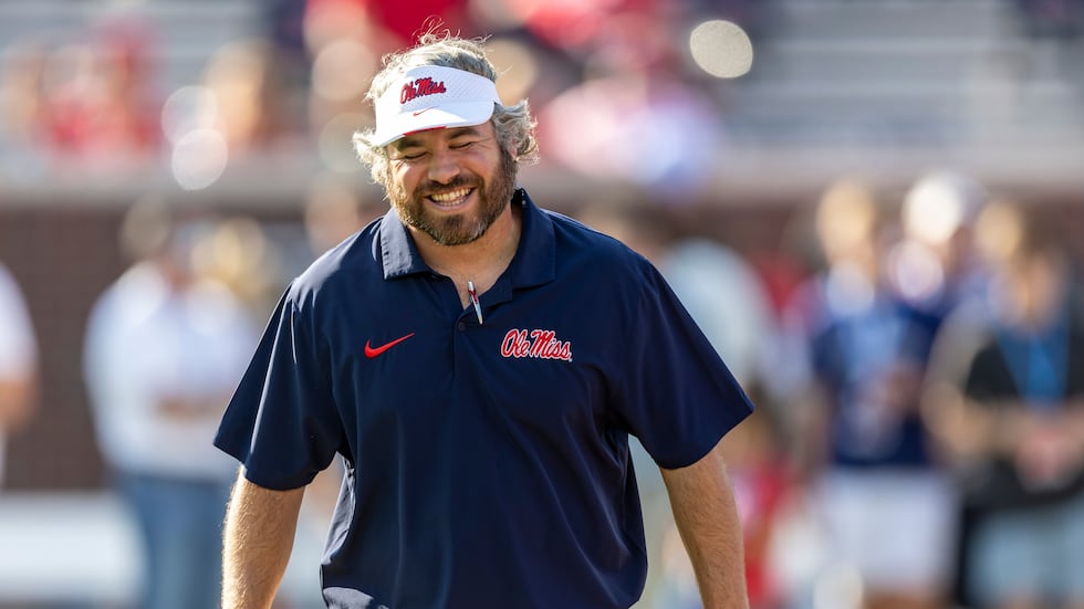 Mississippi defensive coordinator Pete Golding grins on the field before an NCAA football game...