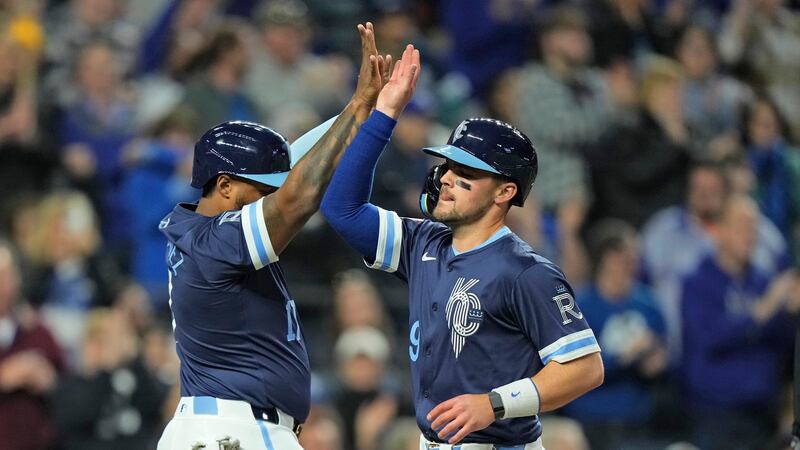 FILE: Kansas City Royals' Nelson Velazquez, left, and Michael Massey celebrate after scoring...