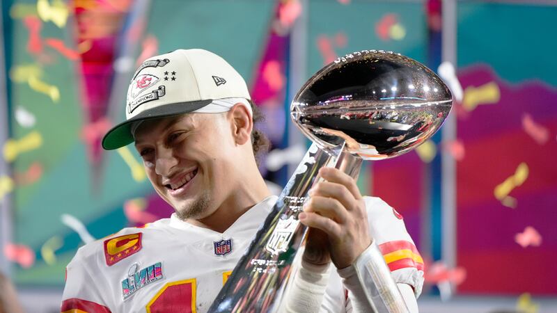 Kansas City Chiefs quarterback Patrick Mahomes (15) holds the trophy after their win against...