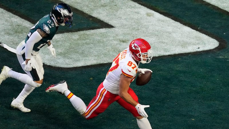FILE: Kansas City Chiefs tight end Travis Kelce (87) scores a touchdown as Philadelphia Eagles...