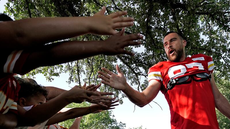 Kansas City Chiefs tight end Travis Kelce greets fans before NFL football training camp...