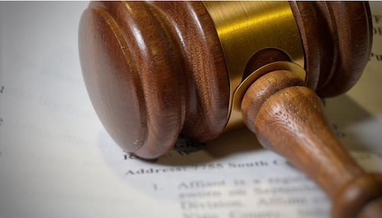 A gavel sits on court documents (FILE Photo)