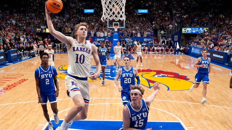 Kansas guard Johnny Furphy (10) goes up for a dunk against BYU during the first half of an...