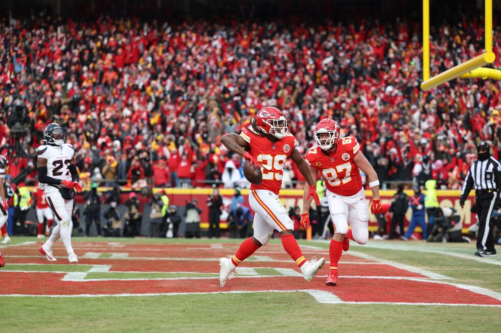 Kansas City Chiefs running back Kareem Hunt, left, is congratulated by teammate Travis Kelce...