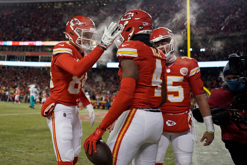 Kansas City Chiefs wide receiver Rashee Rice (4) is congratulated by wide receiver Justin...