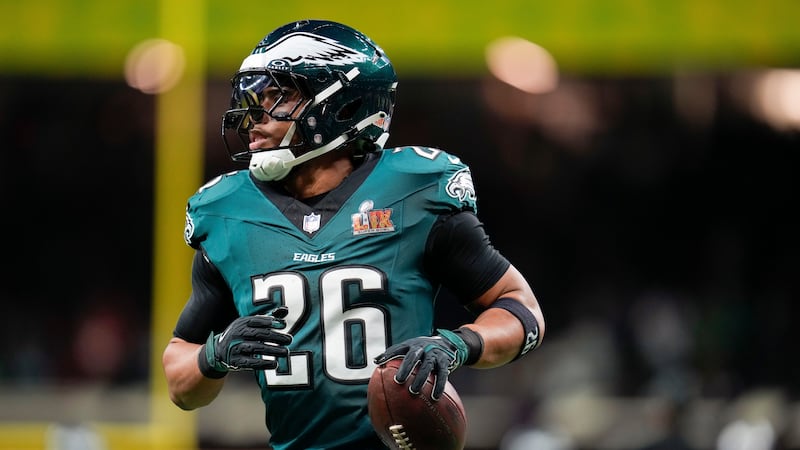Philadelphia Eagles running back Saquon Barkley (26) warms up before the NFL Super Bowl 59...