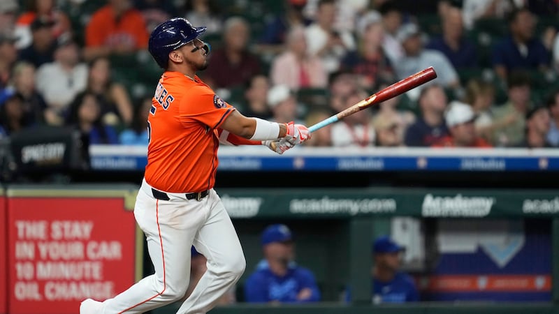 Houston Astros' Isaac Paredes (15) hits a walk off home run during the ninth inning of a...