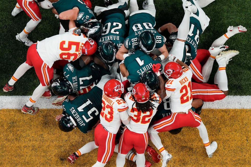 Philadelphia Eagles quarterback Jalen Hurts (1) scores a touchdown against the Kansas City...