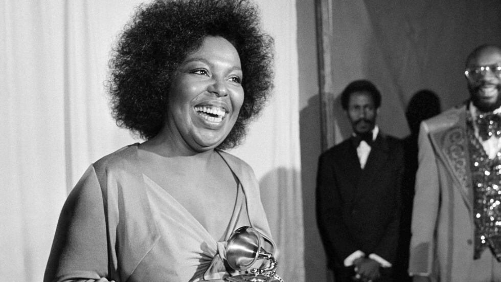 FILE - In this March 4, 1974 file photo, Roberta Flack holds the Grammy award for her record,...