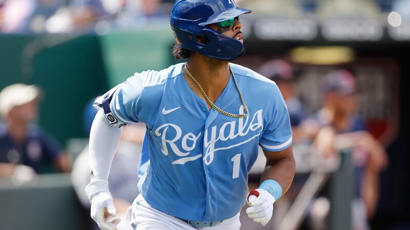 Kansas City Royals' MJ Melendez runs to first base after hitting a sacrifice fly, scoring a...