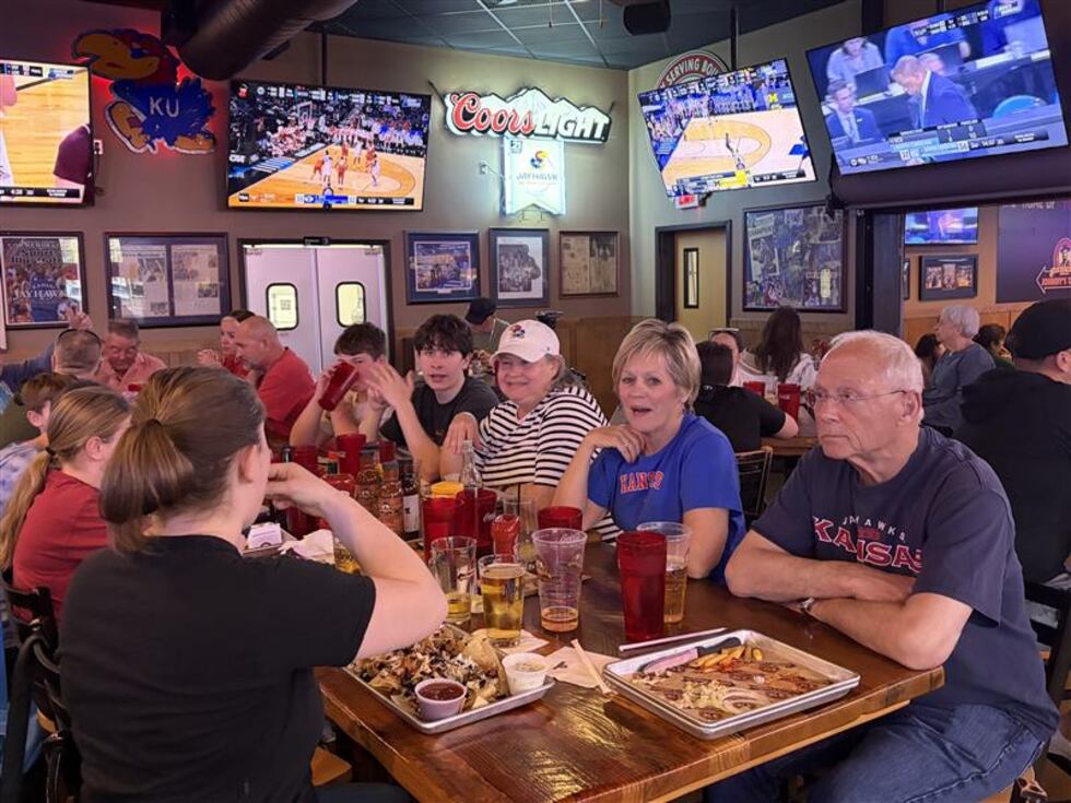 Conversations were little more than a hum at Johnny’s West on Wakarusa Drive Thursday night.