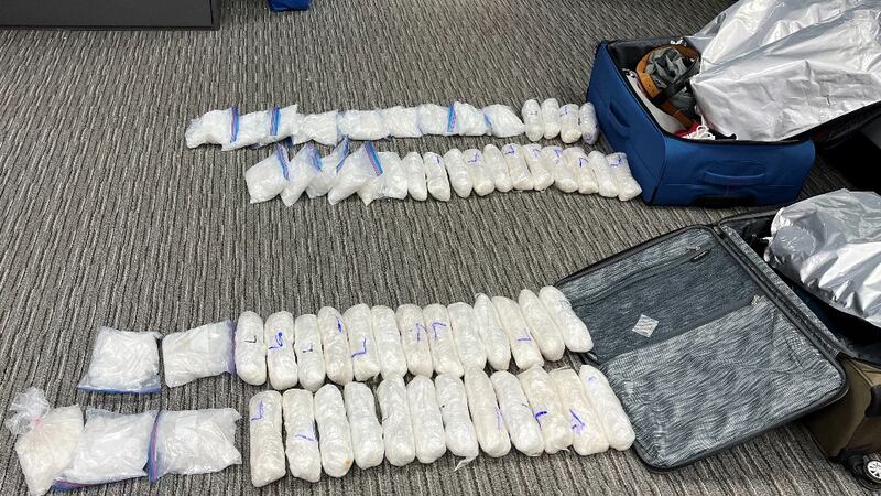 Federal prosecutors released a picture of meth they allegedly found hidden in a suitcase at a...