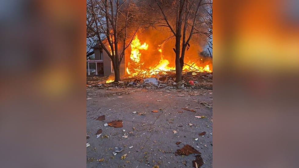 A house on fire in Lexington, Missouri, following an explosion caused by a gas line being...