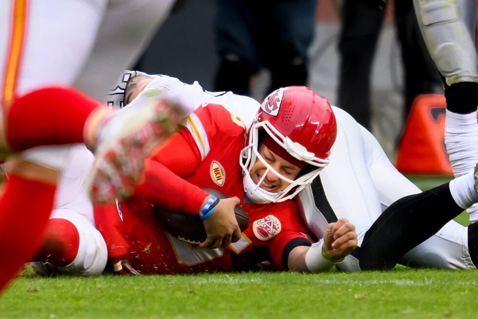 Kansas City Chiefs quarterback Patrick Mahomes is tackled at the end of a run during the...