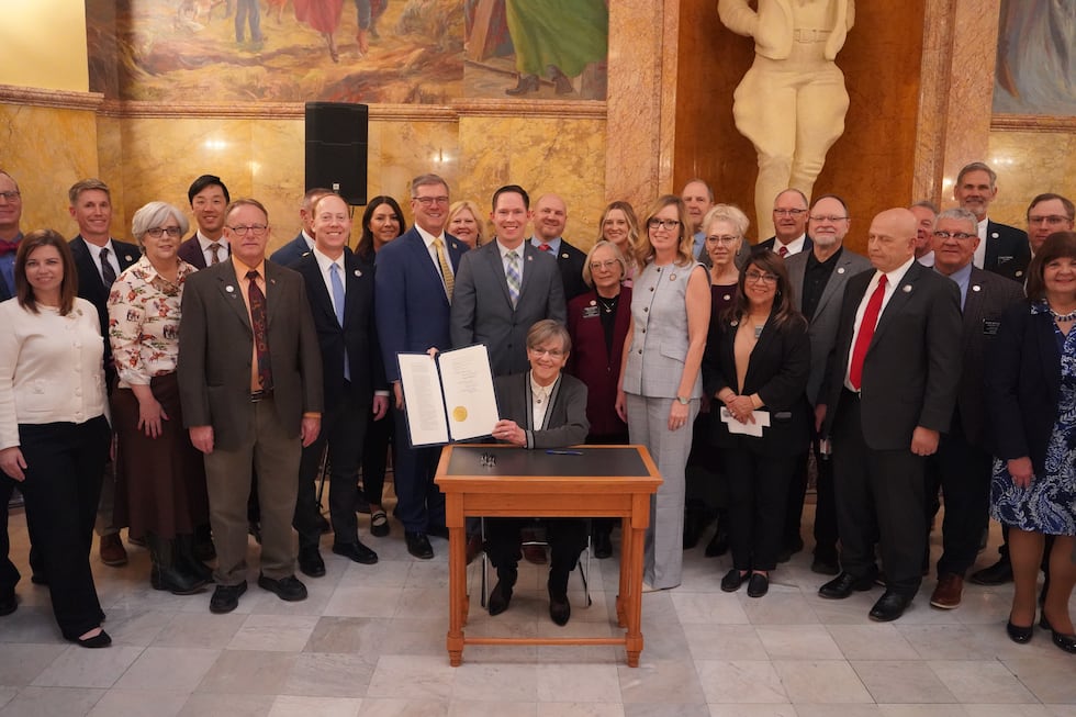 Governor Laura Kelly signs the state's new bell-to-bell cellphone ban into law on March 19, 2026.