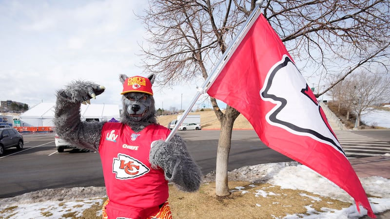FILE - A Kansas City Chiefs fan, Chiefsaholic, poses for photos while walking toward Empower...