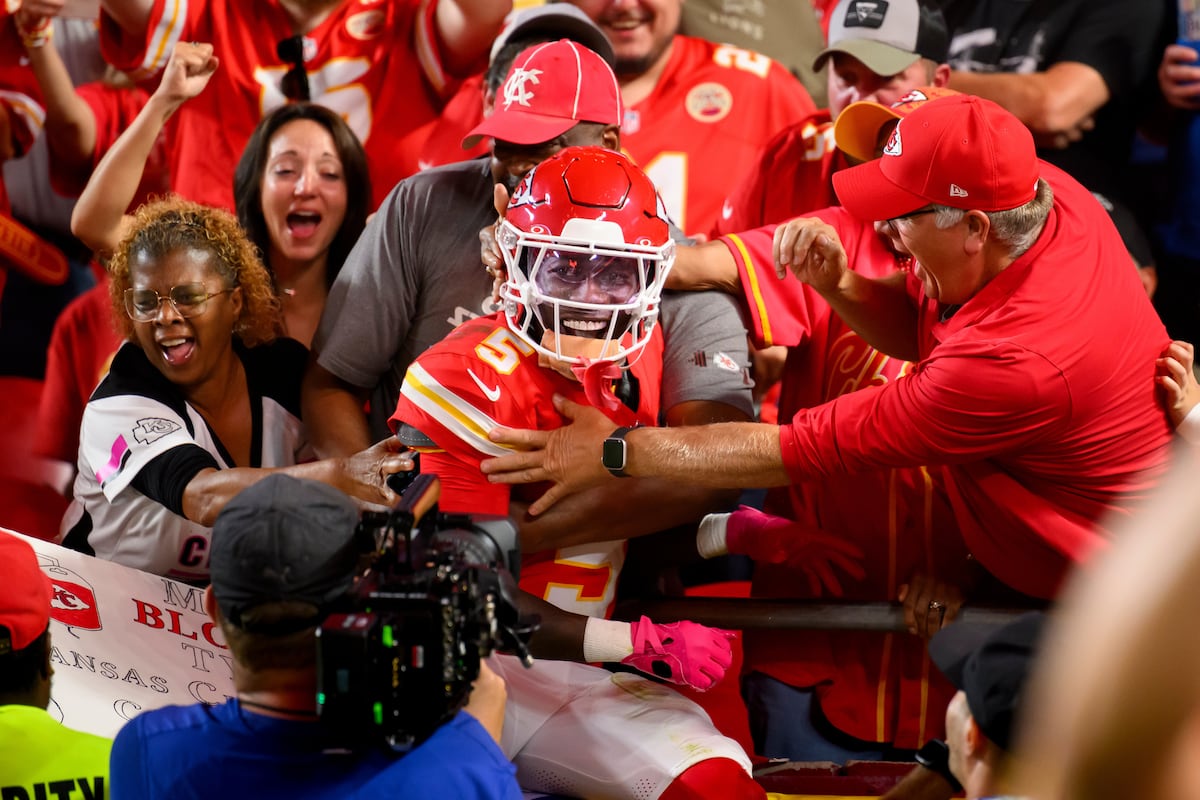 Kansas City Chiefs wide receiver Marquise Brown (5) leaps into the stands to celebrate his...