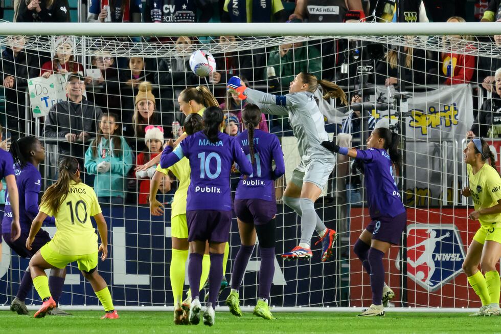 Washington Spirit goalkeeper Aubrey Kingsbury, in grey, clears the ball during the first half...