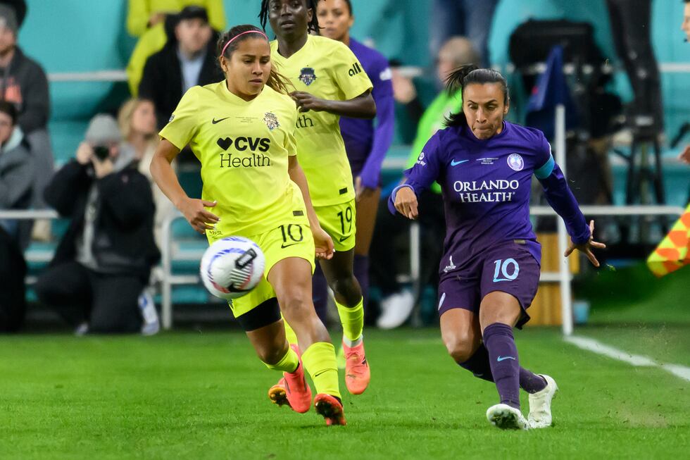 Orlando Pride forward Marta (10) and Washington Spirit midfielder Leicy Santos (10) battle for...