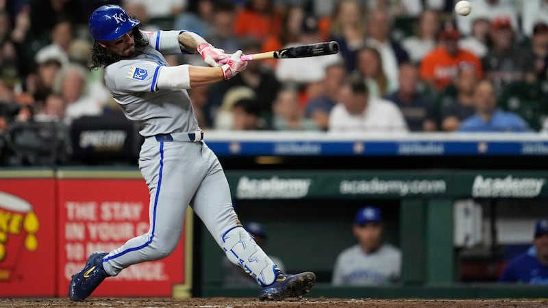 Kansas City Royals' Jonathan India singles during the sixth inning of a baseball game against...