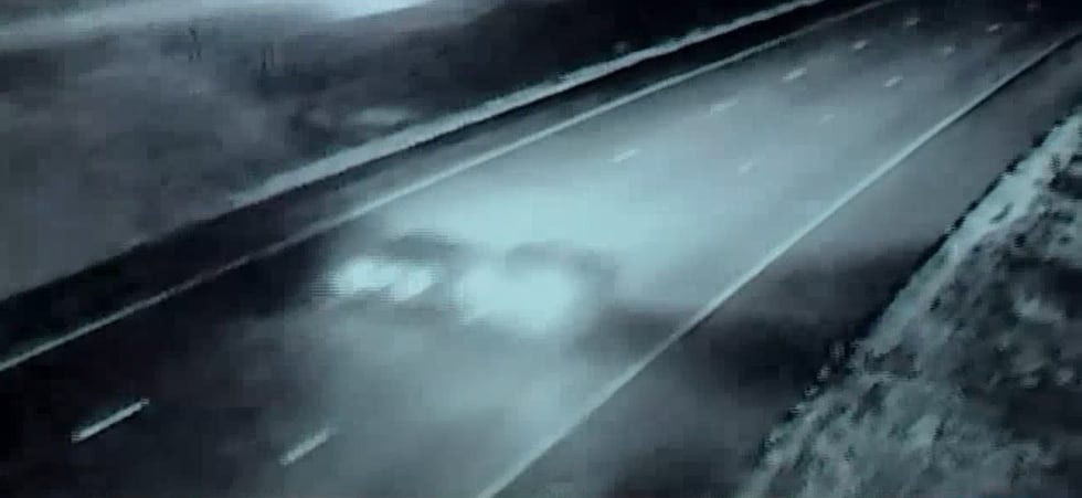 Picture from a scout camera showing what Lenexa police believe are two cars involved in a road...