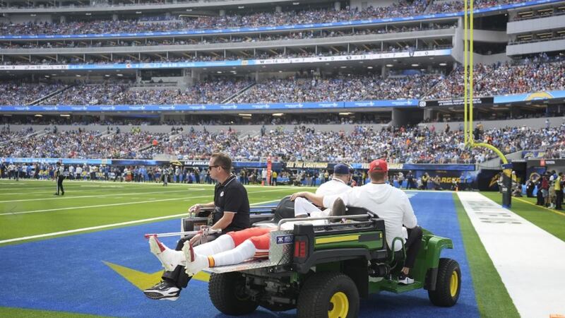 Kansas City Chiefs wide receiver Rashee Rice is taken off the field on a cart after being...