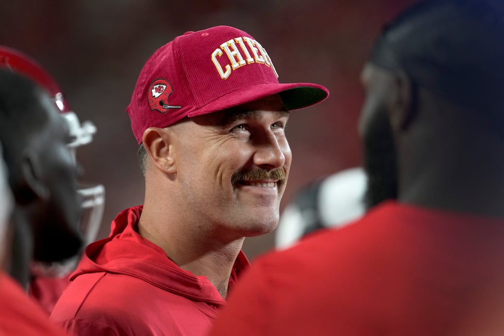 Kansas City Chiefs tight end Travis Kelce smiles on the sidelines during the first half of an...