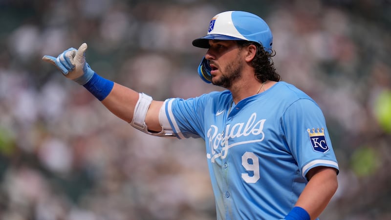 Kansas City Royals' Vinnie Pasquantino (9) gestures to the dugout after hitting a single...