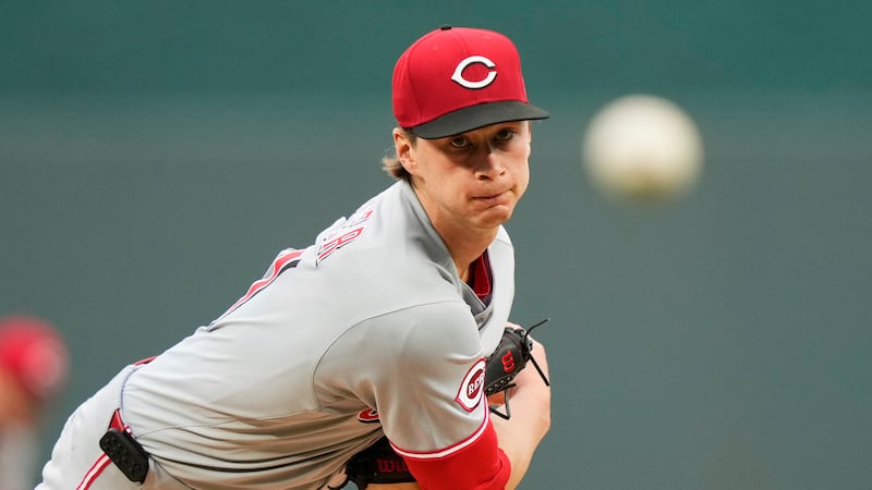 Cincinnati Reds starting pitcher Brady Singer throws during the first inning of a baseball...