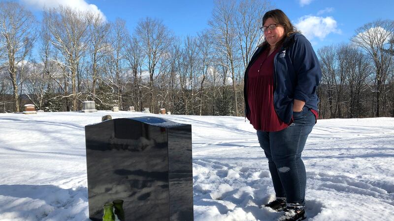 FILE - Deb Walker visits the grave of her daughter, Brooke Goodwin, Thursday, Dec. 9, 2021, in...