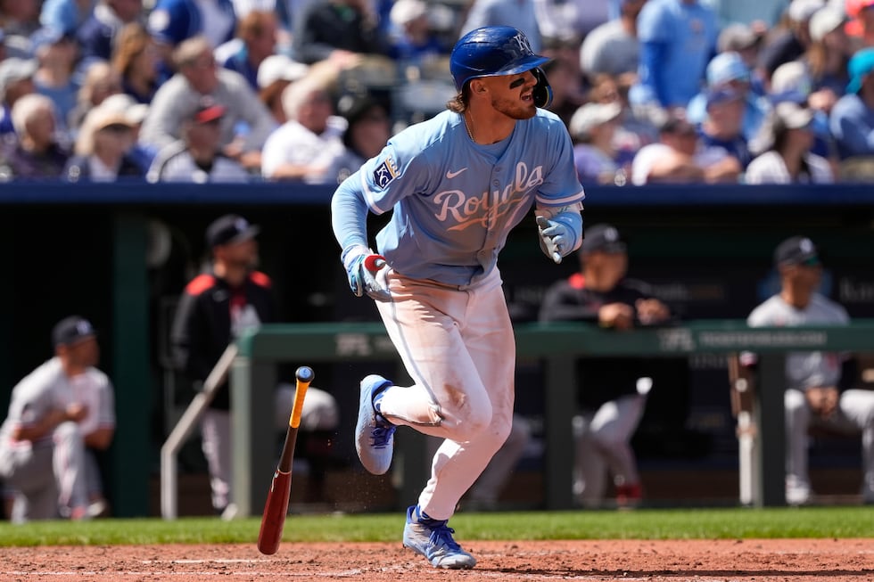 Kansas City Royals' Bobby Witt Jr. watches his sacrifice fly to score one run during the...