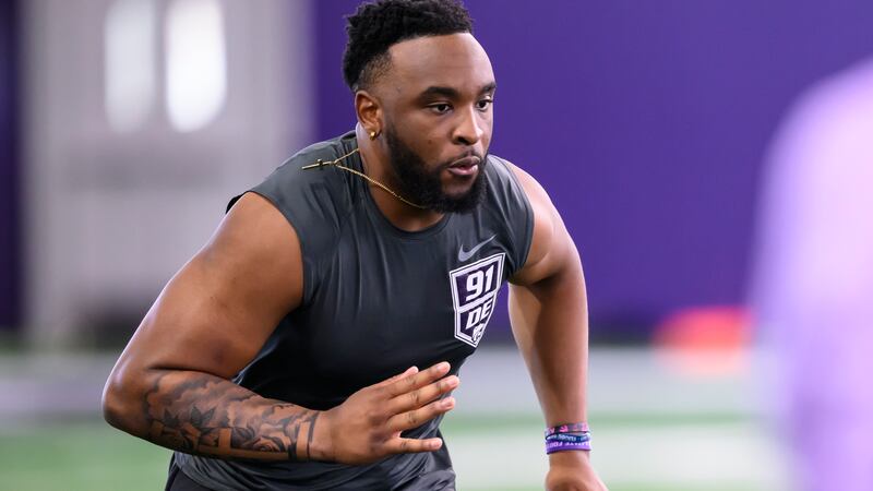 Kansas State defensive lineman Felix Anudike-Uzomah runs a drill during the NCAA college...