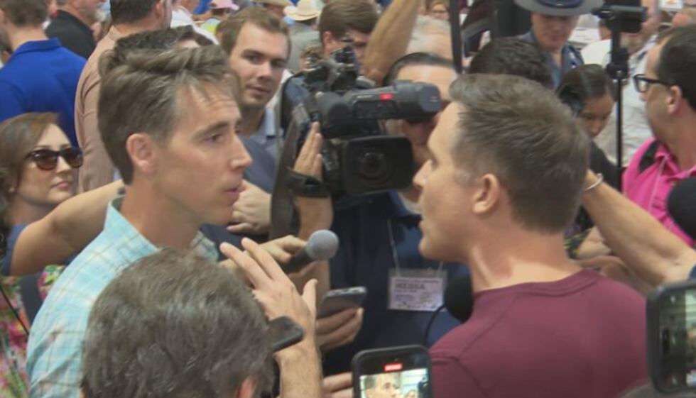 U.S. Senator Josh Hawley (left) and Democratic challenger Lucas Kunce (right) confront each...