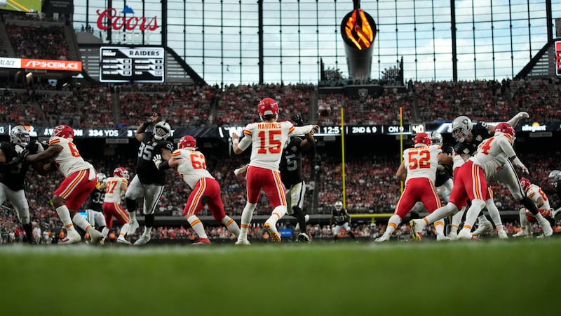 Kansas City Chiefs quarterback Patrick Mahomes (15) throws during the second half of an NFL...