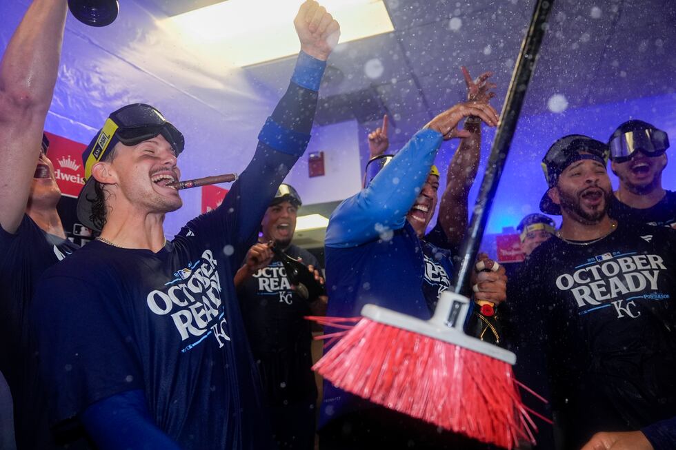 Kansas City Royals shortstop Bobby Witt Jr., left, catcher Salvador Perez, center, and...