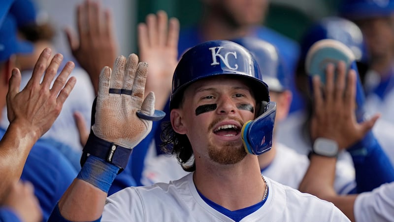 FILE: Kansas City Royals' Bobby Witt Jr. celebrates in the dugout after hitting a three-run...